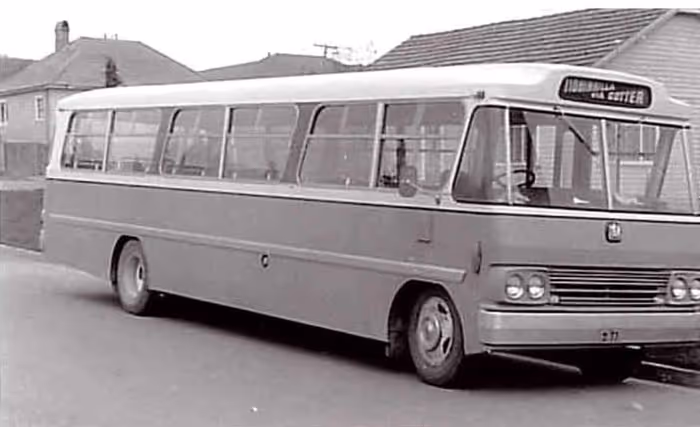 Image of our old charter coaches that were delivering private group tours. In black and white.